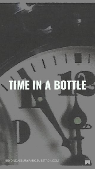 Close-up of an analog clock face with text overlay reading TIME IN A BOTTLE in white letters